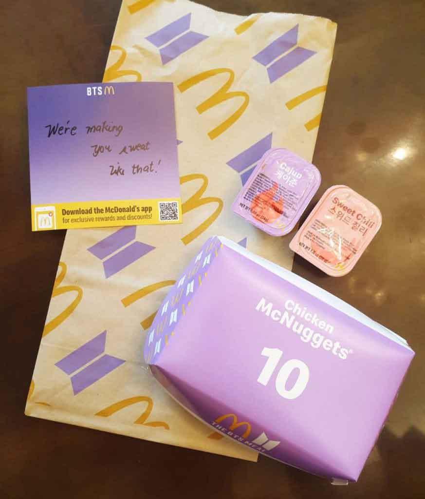 McDonalds BTS Meal in the Philippines with a note that says we're making you sweat like that